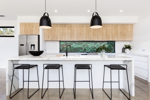 Large luxury Australian kitchen with marble island bench - Australian Stock Image