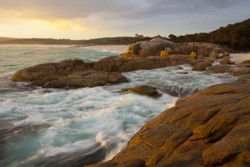 Large rocks with surf breaking - Australian Stock Image