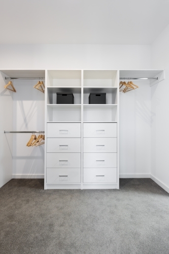 Large walk in wardrobe cabinetry detail - Australian Stock Image