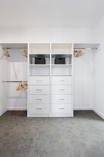 Large walk in wardrobe cabinetry detail