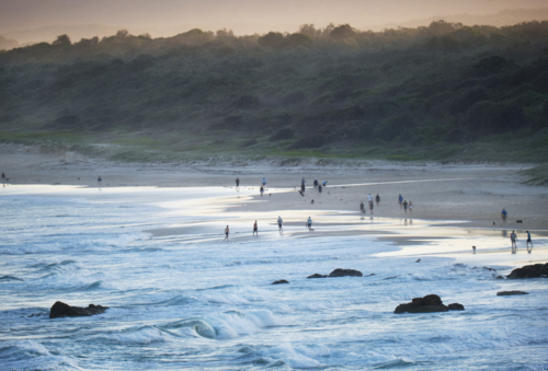 Late afternoon summer beach walking - Australian Stock Image