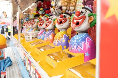 Laughing clowns game attraction at a fair carnival