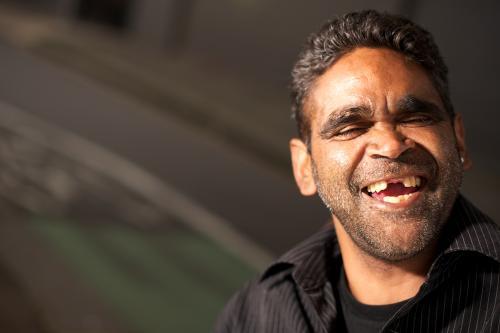 Laughing Indigenous Australian Man with Stubble