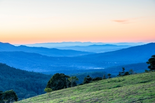Layers of mountains at sunset looking over Gold Coast hinterland. - Australian Stock Image