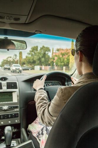 Learner driver getting rain driving experience - Australian Stock Image