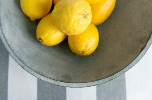 Lemons in a grey bowl - Australian Stock Image