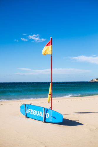 lifeguard red and yellow flags on Maroubra beach - Australian Stock Image