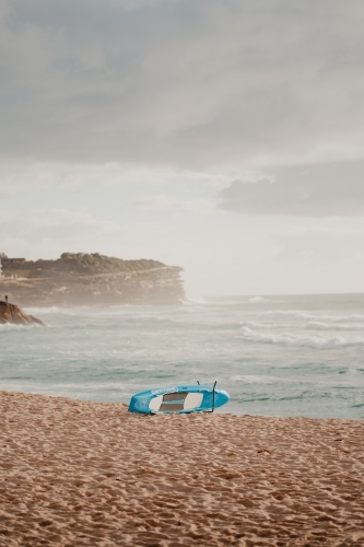 Lifeguard rescue board on the sand at Bronte Beach - Australian Stock Image