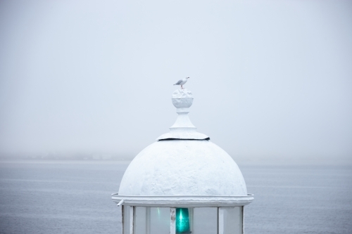 Lighthouse with metal railings in a mist - Australian Stock Image