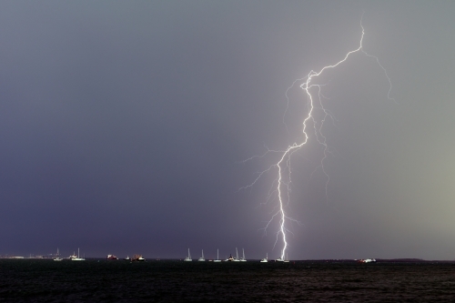 Lightning bolt over yachts in Darwin
