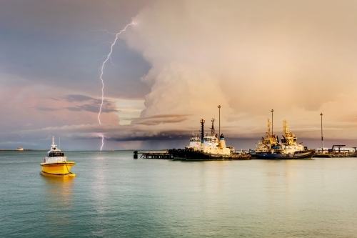 Lightning over Fort Hill Wharf and boats, in Darwin