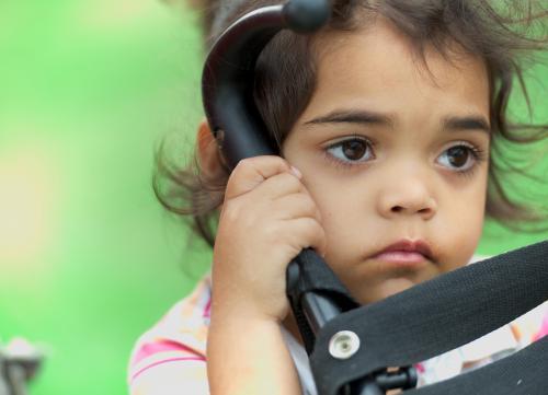 Little Aboriginal Girl on Green Background - Australian Stock Image