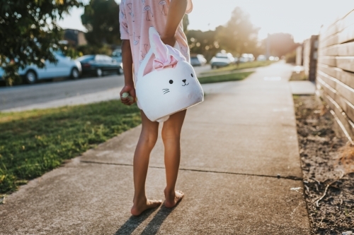 little girl holding Easter bunny basket - Australian Stock Image
