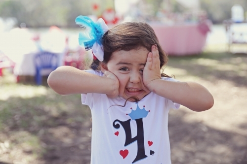 Little girl making faces - Australian Stock Image