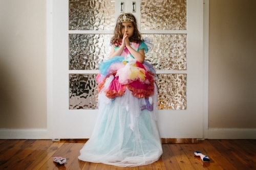 Little girl playing dress ups - Australian Stock Image