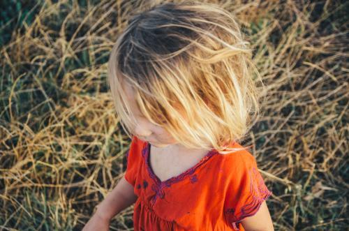 Little girl playing outside