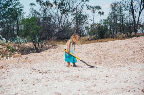 Little girl searching for opals - Australian Stock Image