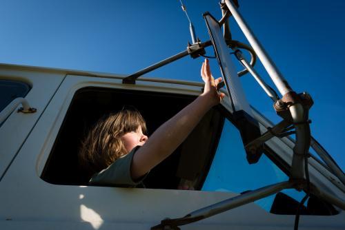 Little girl waiting in a truck