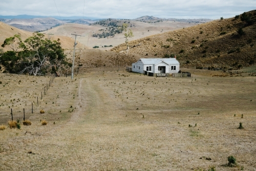 Lone White House in Paddock in Central Highlands Tasmania