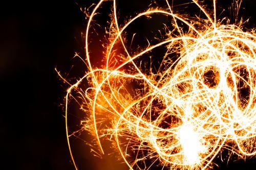 Long exposure of a sparkler being waved at a birthday celebration - Australian Stock Image