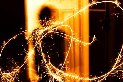 Long exposure of a sparkler being waved at a celebration