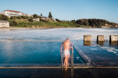 Long exposure of a swimmer leaving the ocean pool