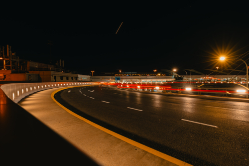 Long exposure shot of night time traffic at Sydney Domestic Airport - Australian Stock Image