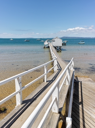 Long jetty leading to boat shed - Australian Stock Image