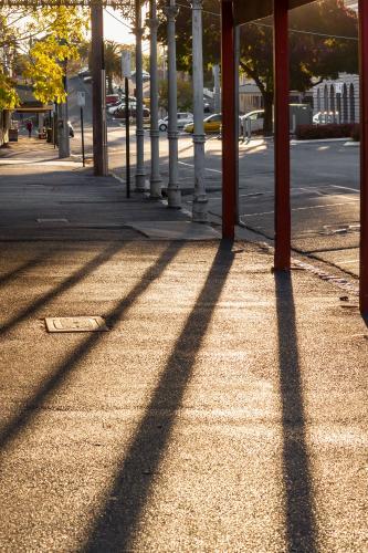 Long shadows from verandah posts - Australian Stock Image