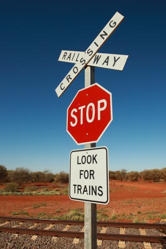 Look for trains railway crossing sign in the outback - Australian Stock Image