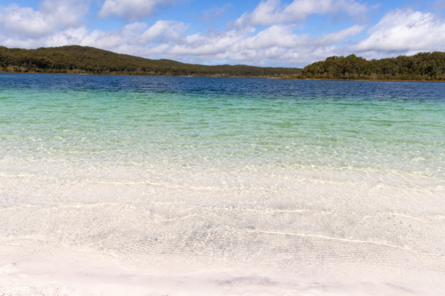 looking across an empty lake on a sunny day - Australian Stock Image