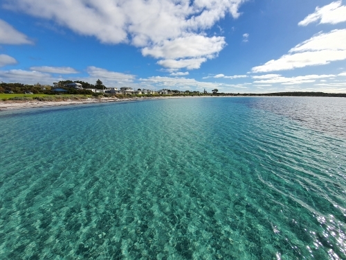 looking across water at seaside town - Australian Stock Image