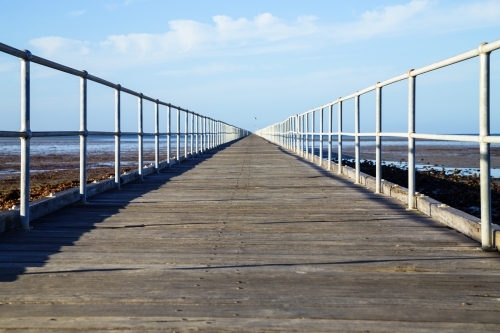 Looking along jetty - horizontal low angle - Australian Stock Image