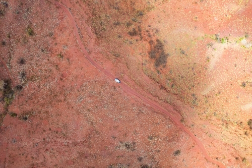 Looking down at car at the dusty red earth road in outback Australia - Australian Stock Image