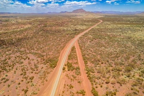 Looking down at intersecting dirt tracks at the red terrain earth - Australian Stock Image