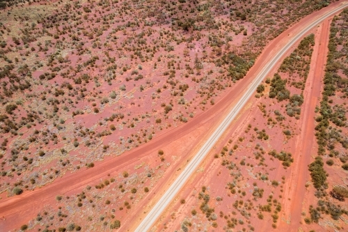 Looking down at red dirt roads going different directions in outback Australia - Australian Stock Image