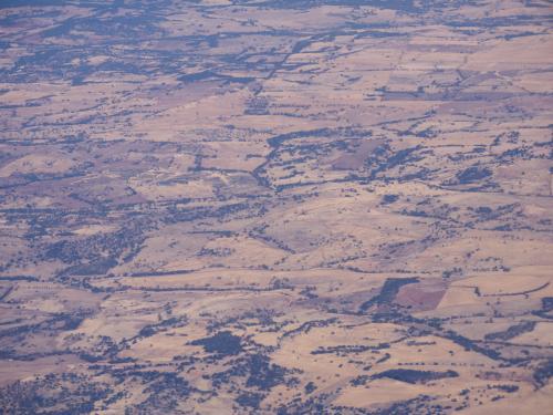 Looking down on dry, undulating, outback hills - Australian Stock Image