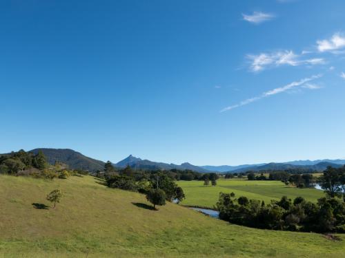 Looking towards Mount Warning and blue sky over green landscape - Australian Stock Image