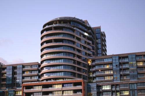 Looking up at city building at the coming of night - Australian Stock Image