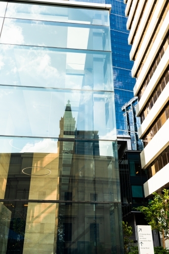 Looking up at high rise city buildings and reflections filling the frame - Australian Stock Image