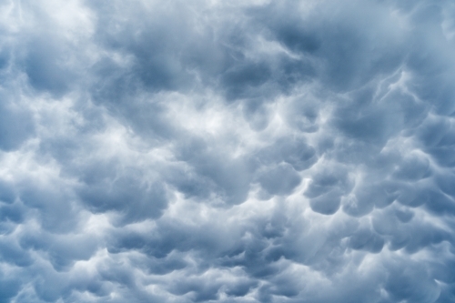 Looking up at patterns of mammatus clouds - Australian Stock Image
