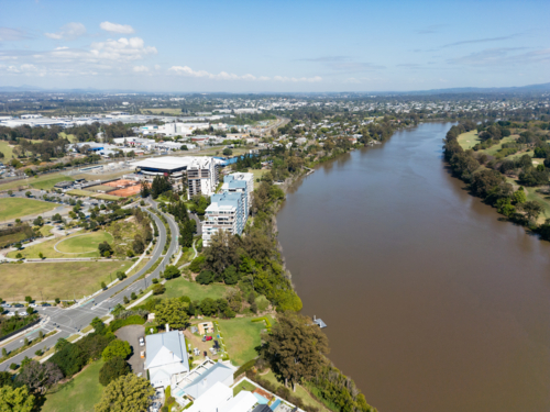 Looking west over the Brisbane River towards the Queensland Tennis Centre - Australian Stock Image