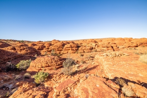 Lookout over the canyon of red arid earth in the bright sun - Australian Stock Image