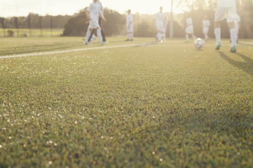 Low view of afternoon soccer training