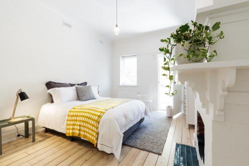 Luxury guest bedroom in vintage scandi styled Australian home - Australian Stock Image