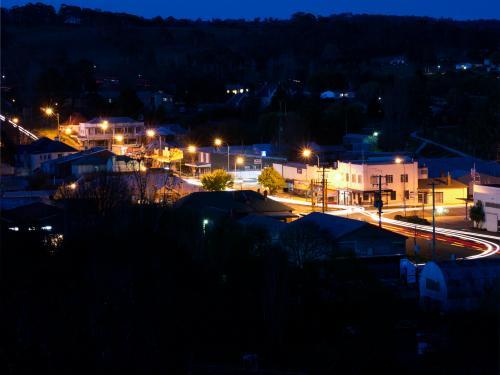 Main street of a country town at night from a distance - Australian Stock Image