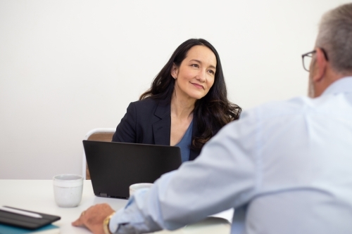 Man and woman collaborating in an office - Australian Stock Image