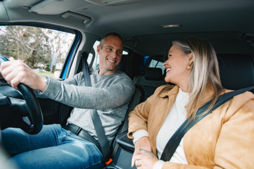 Man and woman travelling in a car together - Australian Stock Image
