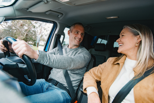 Man and woman travelling in a car together - Australian Stock Image