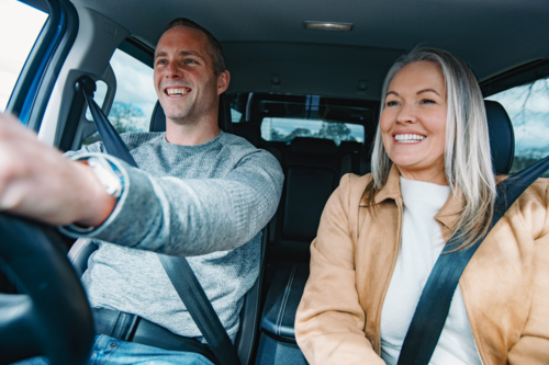 Man and woman travelling in a car together - Australian Stock Image